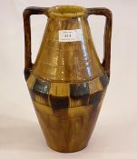 A 1970s studio pottery twin handled treacle glazed vase H35cm