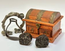 A pair of Indian treen wire mounted elephant printing blocks (8cm x 8cm), a steel stirrup (15cm x