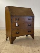 An Edwardian inlaid oak bureau, the fall front revealing fitted interior, over three graduated
