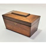 A 19thc rosewood sarcophagus shaped tea caddy, the top with fluted panel enclosing two tea