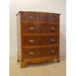 A Georgian style yew and satinwood inlaid bow front chest, fitted with four graduated drawers,