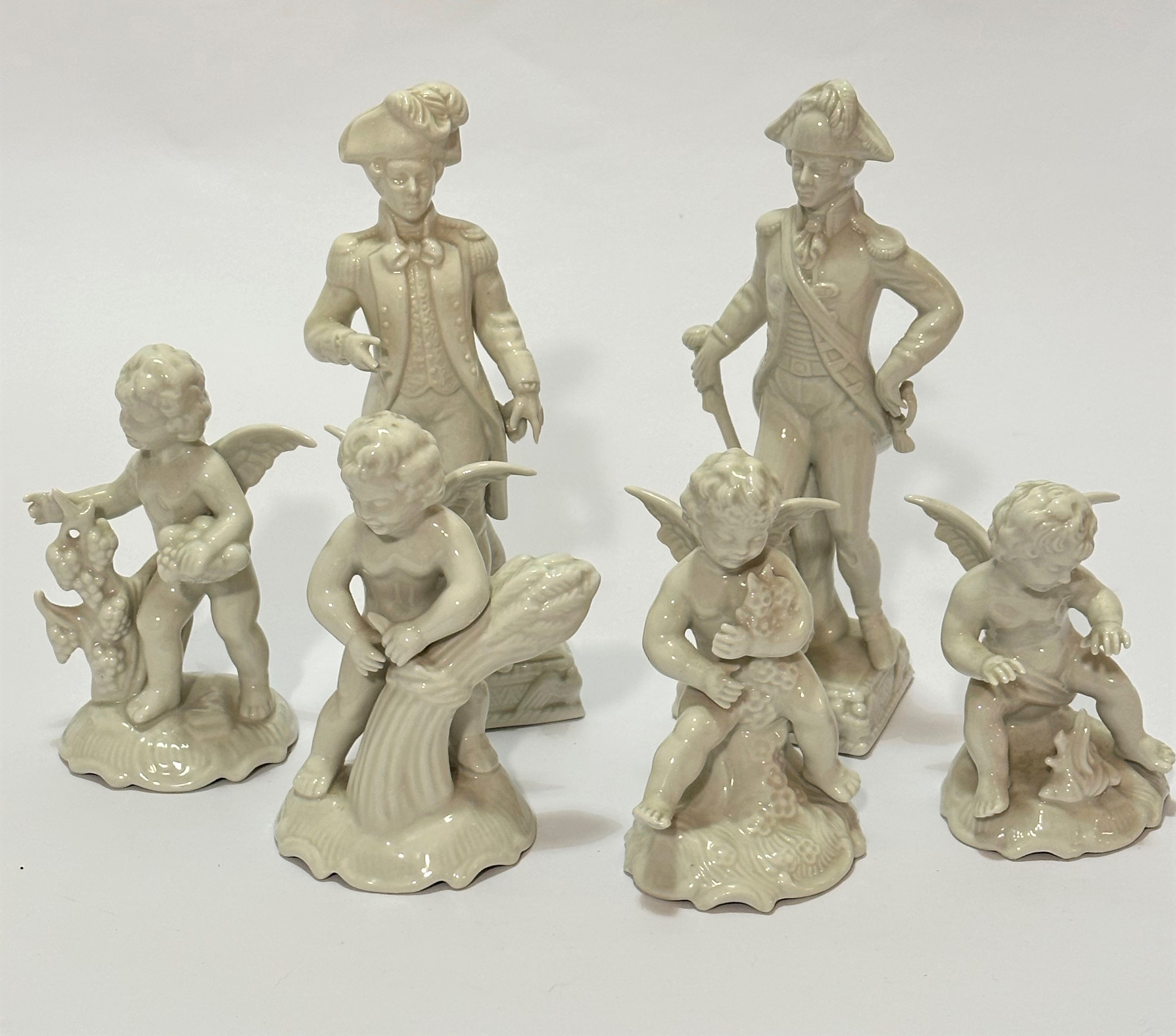 A set of four Dresden Hendarbeit blanc de chine putti figures of the Four Seasons, (tallest h 16cm),