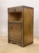 A 1940s oak veneered bedside chest with open shelf over cupboard, H67cm W38cm D34cm