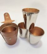 Mawson's of Newcastle set of four Epns gilt lined travelling stirrup cups, complete with leather