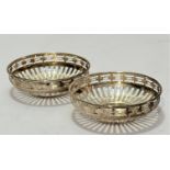 A pair of Birmingham silver pierced bonbon dishes, (2.5cm x 8cm) (44g)