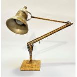A 1950s anglepoise anodised aluminum and metal lamp with original painted cream and gilt finish, (