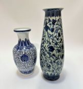 A Chinese porcelain baluster vase decorated with chrysanthemum flower head and scrolling leaf design