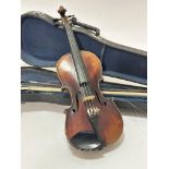 A late 19thc early 20thc satinwood two piece back four string violin, complete with chin rest, has