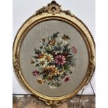 A Victorian gilt oval rope pattern bordered frame containing a grospoint panel spray of flowers, (