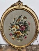 A Victorian gilt oval rope pattern bordered frame containing a grospoint panel spray of flowers, (