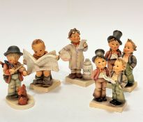 A collection of five various Hummel pottery figures including two sets of singer figures, (h 14cm
