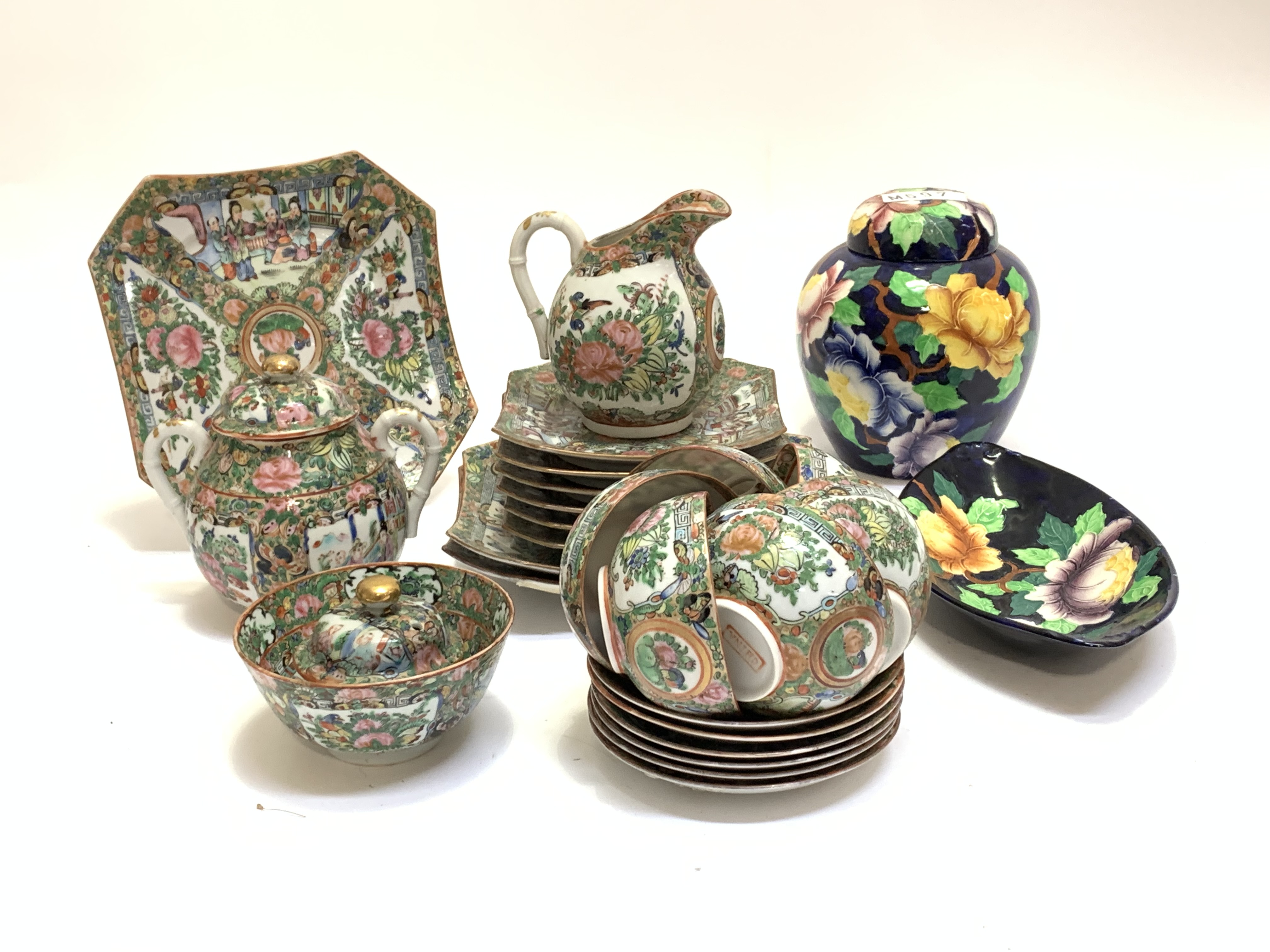 A Chinese Canton Famille verte tea set, comprised three serving plates, six side plates, six cups
