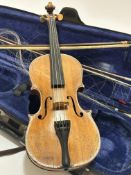 An unmarked 19thc two piece satinwood 3/4 size violin, shows signs of general wear and use, (L 55cm)