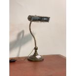 An early 20th century articulated brass desk light, H37cm