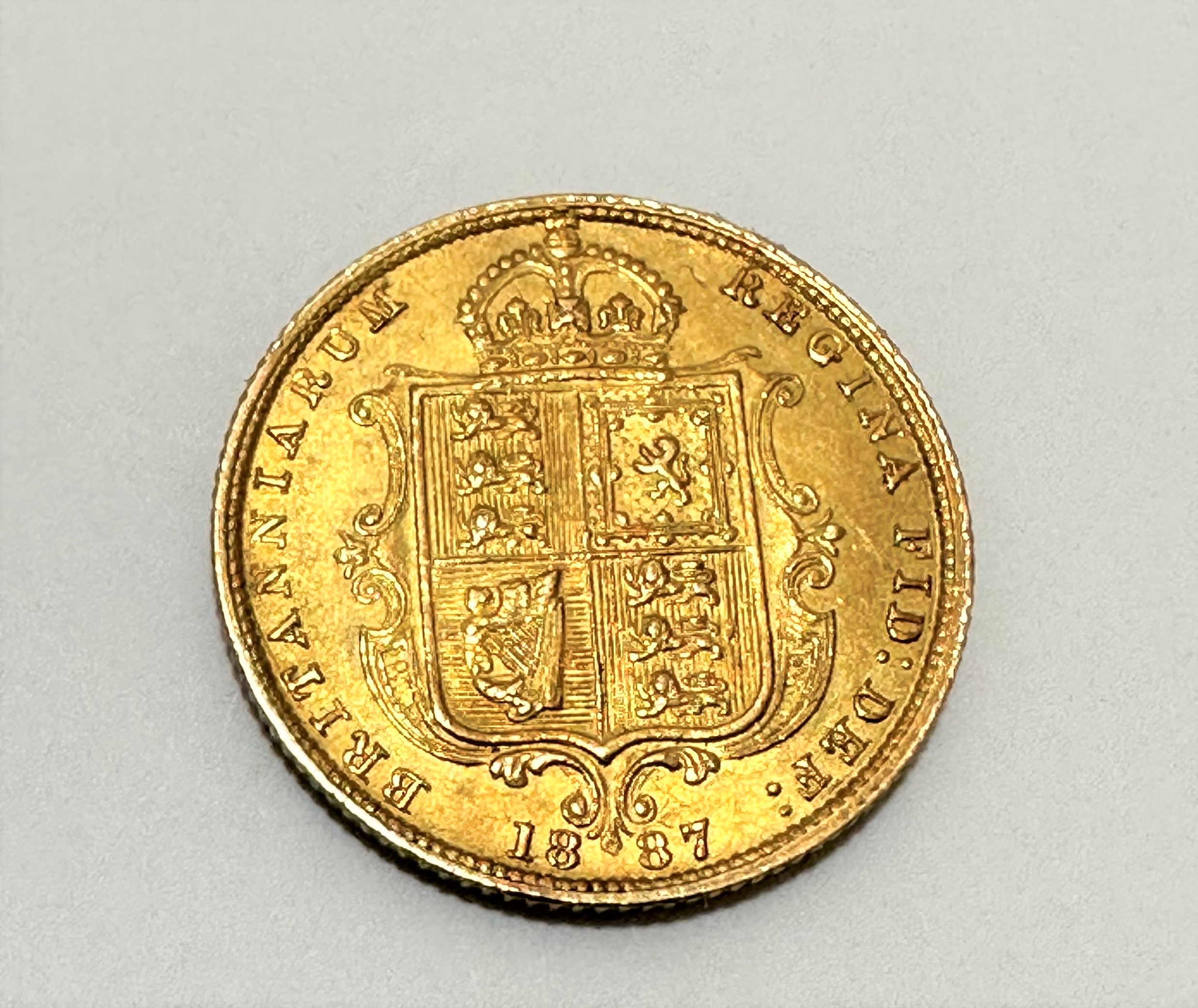 A Victorian gold half Sovereign, dated 1887, spot of white paint to front - Image 2 of 2