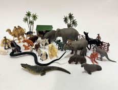 A collection of Britain's plastic zoo animals including elephant and calf, rhino and calf,