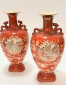 A pair of Japanese baluster form vases with dragon decorated handles to side and flared rims, with