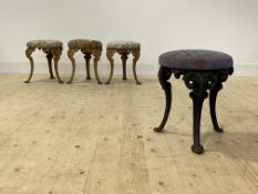 A set of four 19th century cast iron stools, the circular upholstered seats raised on leaf cast '