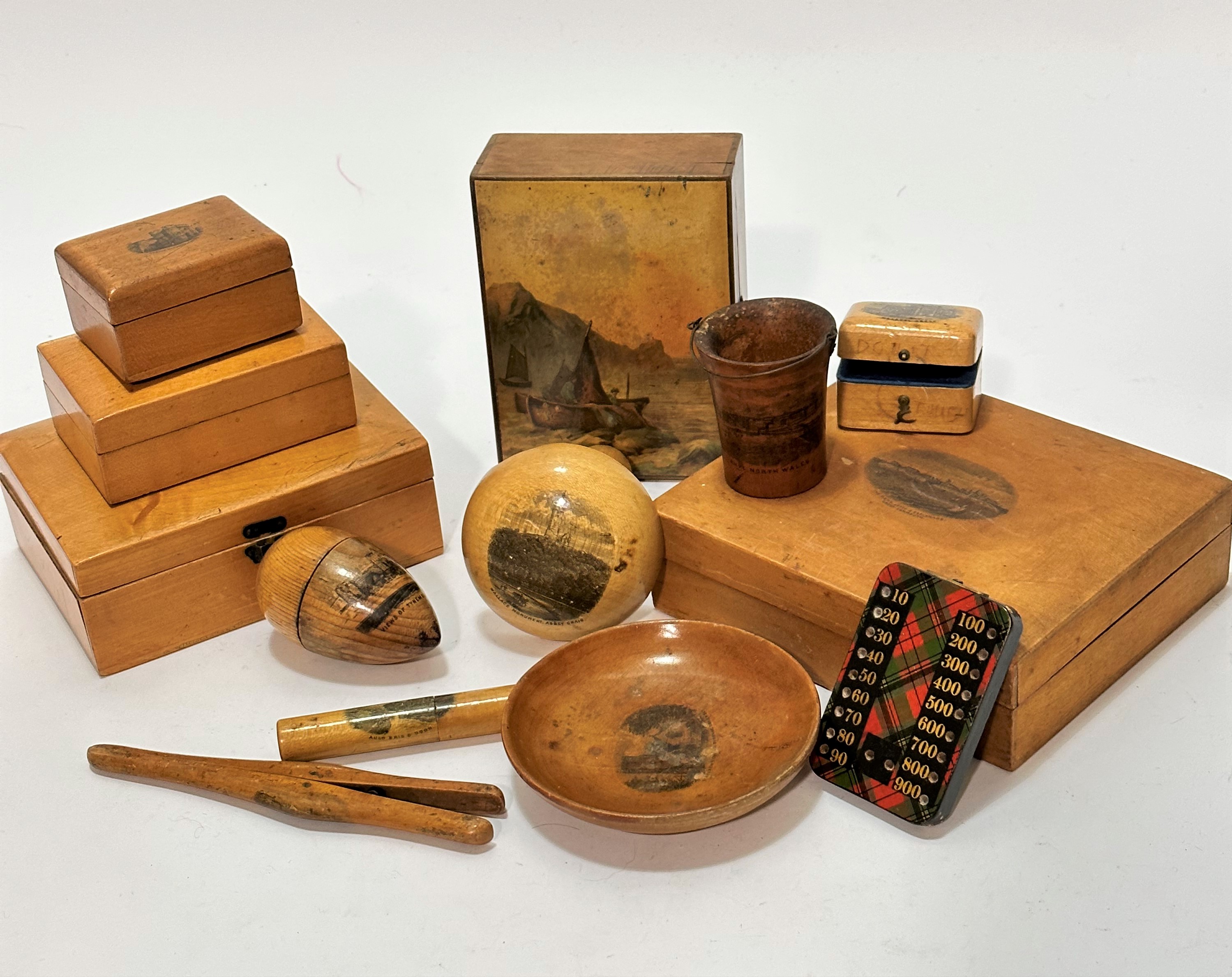 A collection of satinwood birch Mauchline style ware including a rectangular box decorated with view