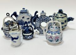 A collection of seven various miniature teapots including an octagonal shaped one with spout and