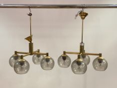 A pair of lacquered brass four branch ceiling light fittings, circa 1970's, each branch with a domed