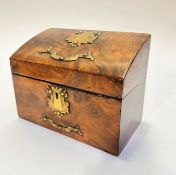 A Victorian burr walnut slope front stationery box with brass shield shape plaque to front and