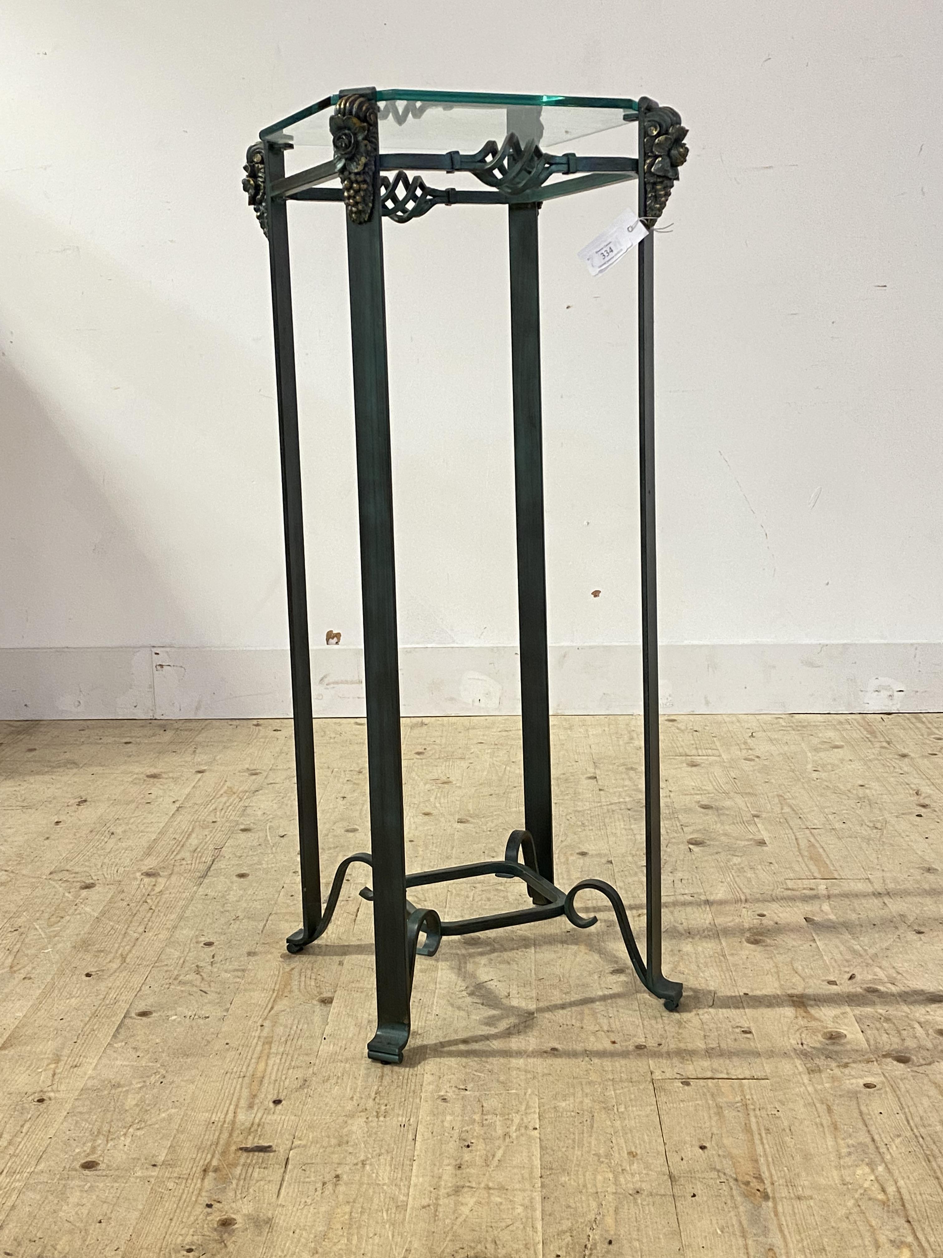A patinated metal and glass jardienere stand, H96cm, 38cm x 38cm