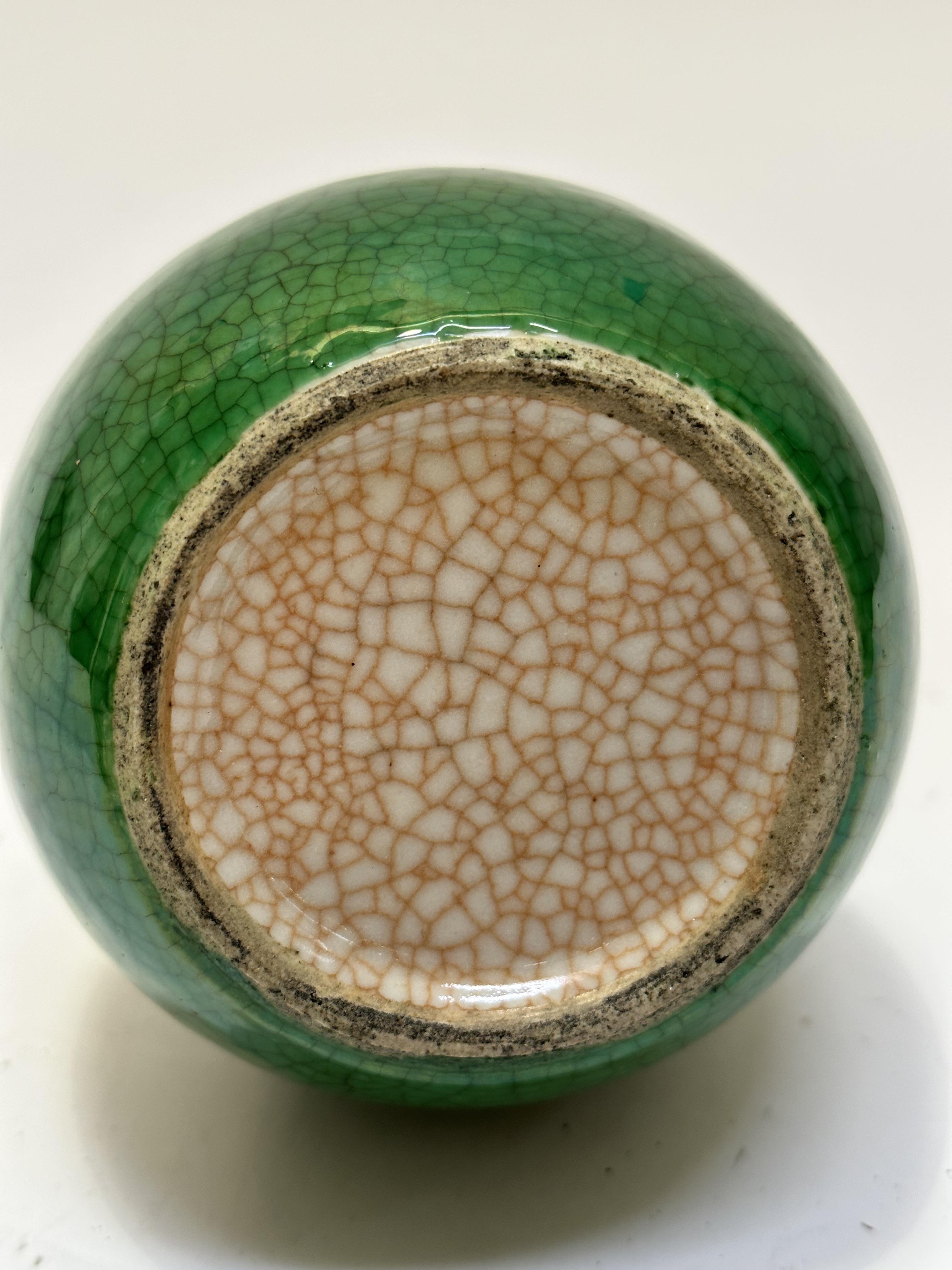 A late 19thc Chinese slim necked bottle style vase with green craquelure glaze, (h 20cm) no signs of - Image 4 of 7