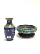 A Chinese Cloisonné vase of flared baluster form, the blue ground deocrated with opposing