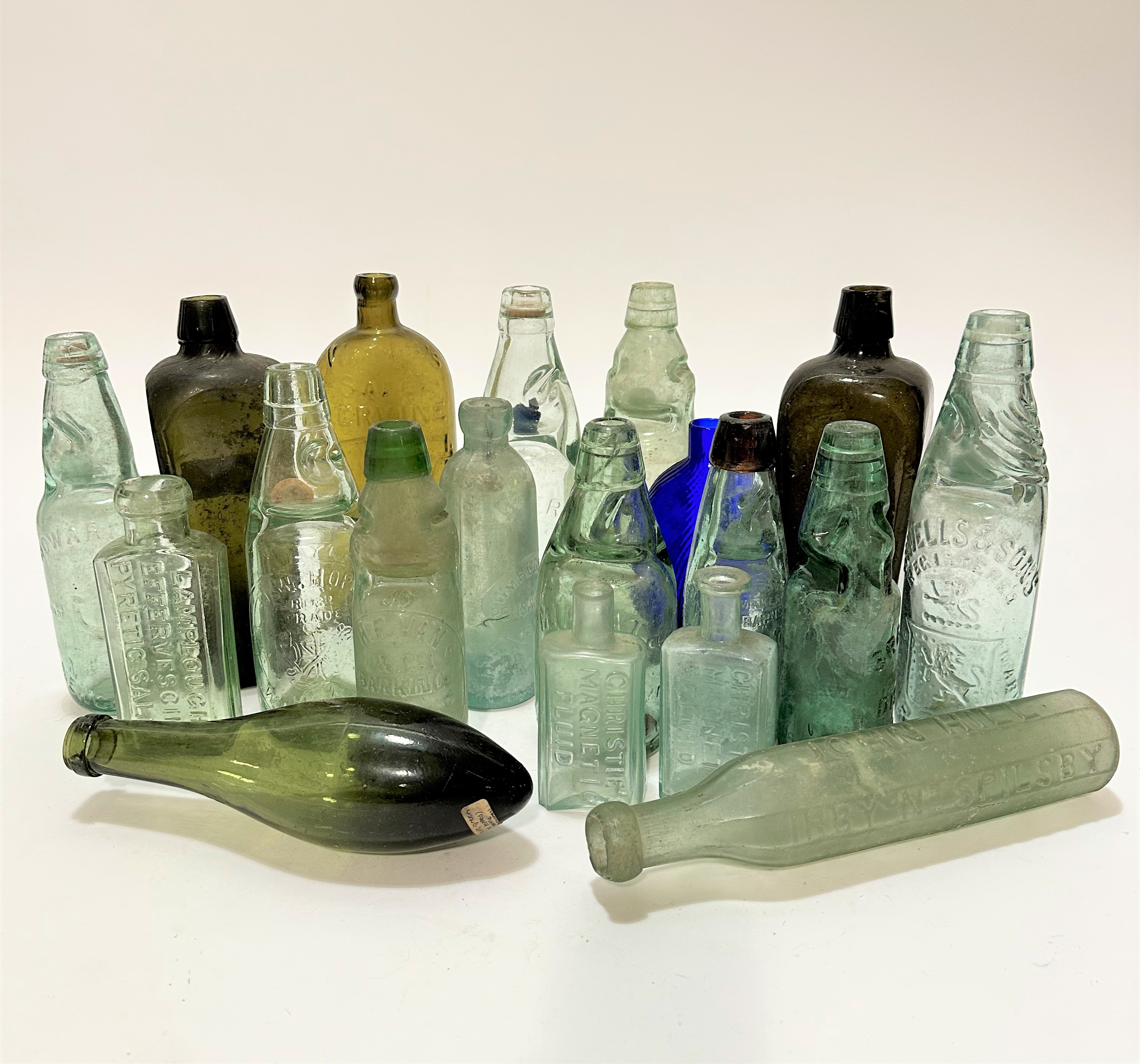 A collection of nineteen various bottles including Christie's Magnetic Fluid, Lamplough's