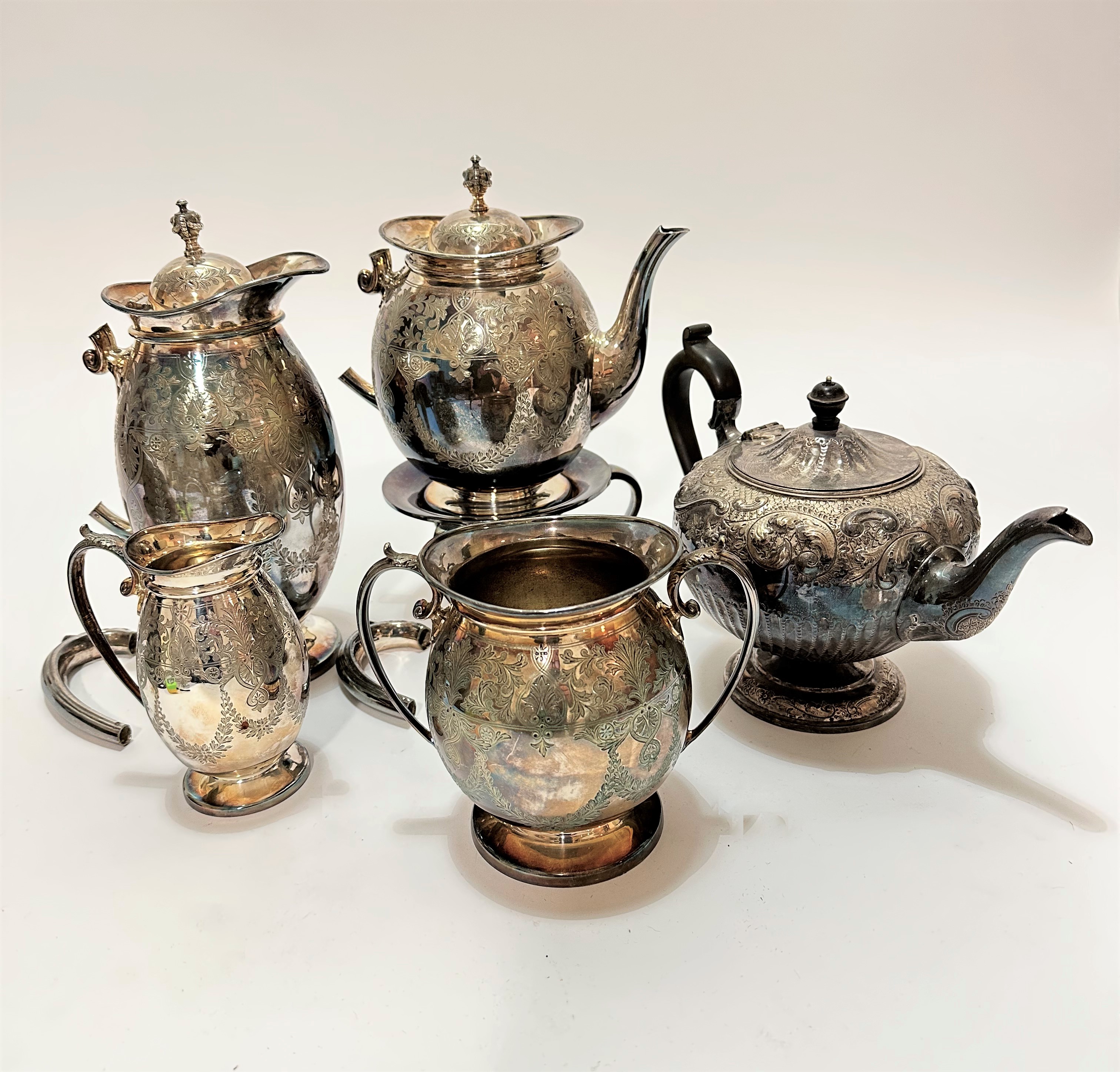 An Edwardian Epns four piece engraved tea and coffee service, with hot water jug, teapot and