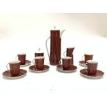 A Retro Coffee Set 'Cmieilow Made In Poland' comprising six cups and saucers, sugar basin, coffee