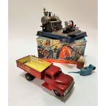 A West German tin plate model of a 1950s dumper truck, (10cm x 30cm x 9.5cm) complete with tyres,