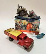 A West German tin plate model of a 1950s dumper truck, (10cm x 30cm x 9.5cm) complete with tyres,