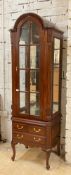 An 18th century inspired hardwood display cabinet, the domed top over door with sectional bevelled