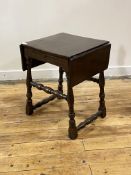 An oak candle table of 18th century design, the top with two drop leaves over candle slides to