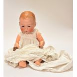 An Armand Marseille German baby bisque head doll model 351./8k with flirty eyes and open mount and