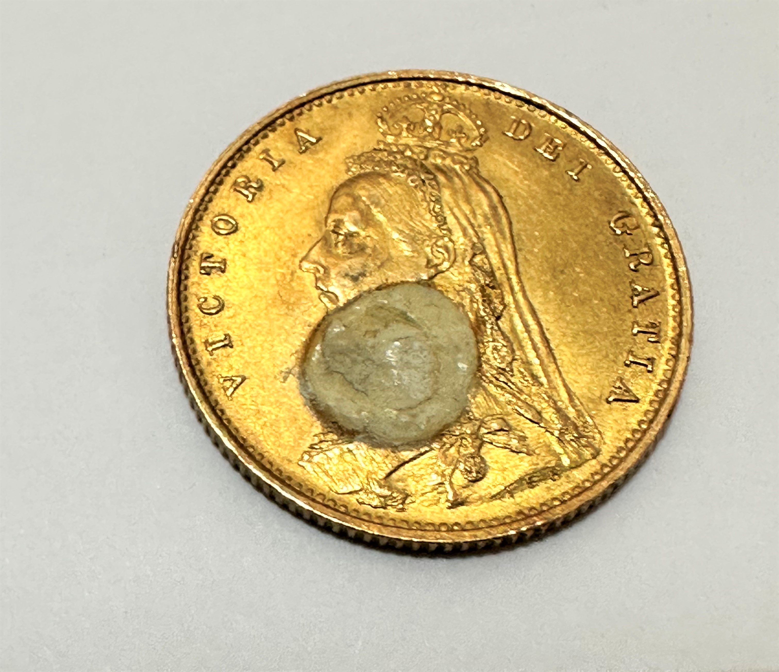 A Victorian gold half Sovereign, dated 1887, spot of white paint to front