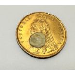 A Victorian gold half Sovereign, dated 1887, spot of white paint to front