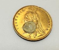 A Victorian gold half Sovereign, dated 1887, spot of white paint to front