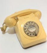 A British Telecom white plastic 1970s / 80s dial telephone converted to modern fitting, (13cm x 14cm