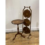 A Georgian style mahogany wine table, early 20th century, the circular dished top centred with