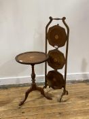 A Georgian style mahogany wine table, early 20th century, the circular dished top centred with