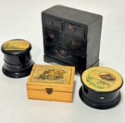 A Japanese miniature black lacquered chest with floral and gilt leaf and flower decoration, (15.