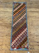 A Chobi kilim runner rug of typical geometric design, 197cm x 60cm