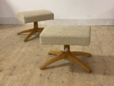 Ercol, a pair of foot stools, upholstered in oatmeal chenille fabric, raised on a blonde elm four