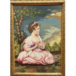 An Edwardian gilt glazed frame with a petit and grospoint panel depicting a young girl in pink dress