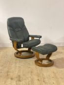 Ekornes, a Stressless reclining lounge chair and footstool, upholstered in green leather, (frame A/