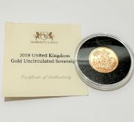 A Heartington and Byne 2018 gold uncirculated Queen Elizabeth II gold Sovereign, complete with