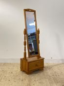 A polished pine cheval mirror with drawer to base, H157cm